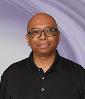 OLLI at UNLV member Filemon Manansala smiles for a portrait. Member since 2007.